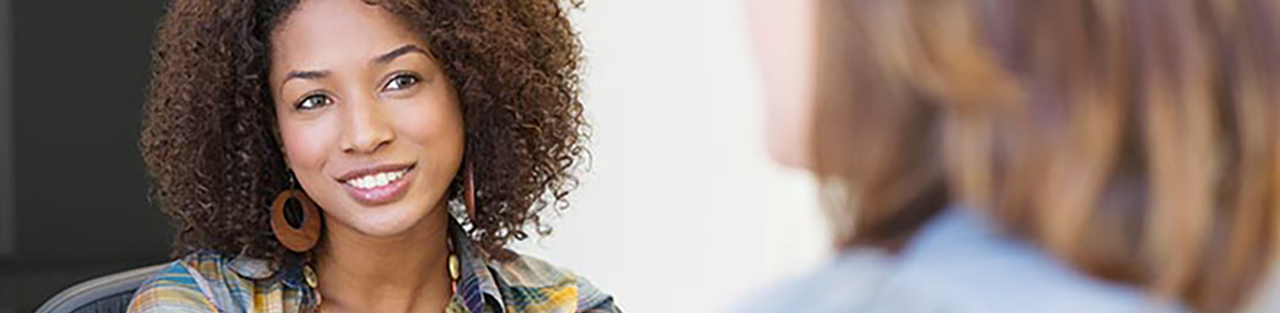 Woman with dark hair smiling